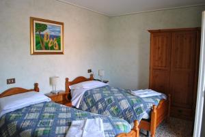 מיטה או מיטות בחדר ב-La Lanterna di Guiglia