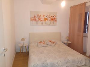 Łóżko lub łóżka w pokoju w obiekcie Fabretti House - Centro storico