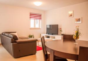 TV a/nebo společenská místnost v ubytování Holiday Home Puteus