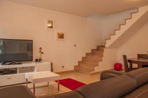 TV a/nebo společenská místnost v ubytování Holiday Home Puteus