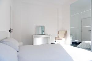 Katil atau katil-katil dalam bilik di Linate Garden house Mecenate