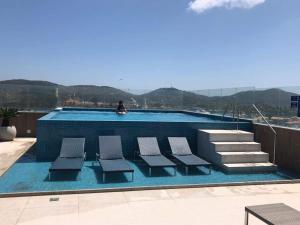Бассейн в Hotel Cabo Frio или поблизости