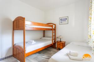 Ένα ή περισσότερα κρεβάτια σε δωμάτιο στο Laja Bermeja by Cadiz Time +15 φωτογραφίες