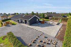 an aerial view of a house with a playground at Activity House - Flovt Strand, Haderslev in Haderslev