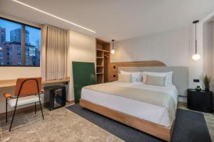 A bed or beds in a room at LIN Boutique Hotel by HOUSY HOST
