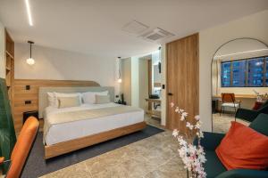 A bed or beds in a room at LIN Boutique Hotel by HOUSY HOST