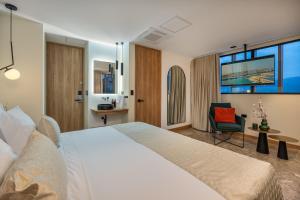 A bed or beds in a room at LIN Boutique Hotel by HOUSY HOST