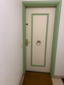a green and white door with a mirror at Merazur in Fréjus +18 photos