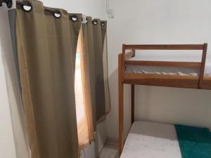 Palanda nebo palandy na pokoji v ubytování Recanto Pousada JU&JU com piscina COMPARTILHADA