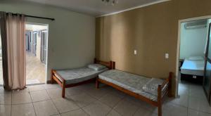 Postel nebo postele na pokoji v ubytování Recanto Pousada JU&JU com piscina COMPARTILHADA + 37 fotografií