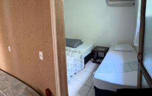 Postel nebo postele na pokoji v ubytování Recanto Pousada JU&JU com piscina COMPARTILHADA