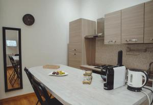 a kitchen with a counter top with a coffee maker at Royal Palace B&B in Caserta