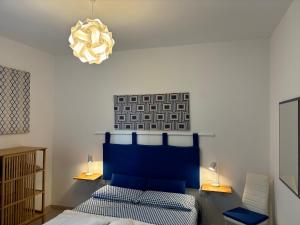 Posteľ alebo postele v izbe v ubytovaní Assajè Guestroom