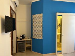 Televízia a/alebo spoločenská miestnosť v ubytovaní Assajè Guestroom
