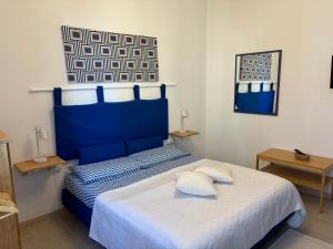 Posteľ alebo postele v izbe v ubytovaní Assajè Guestroom