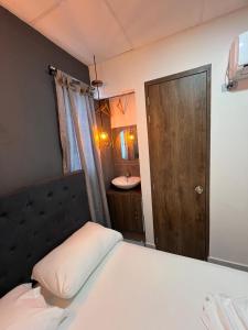 Voodi või voodid majutusasutuse Hotel Almalu toas