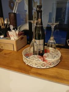 two bottles of wine sitting on a wooden table at L’annexe sur mer in Le Portel +17 photos