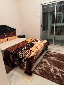 Ένα ή περισσότερα κρεβάτια σε δωμάτιο στο Apparemment pas cher à mohammedia +4 φωτογραφίες