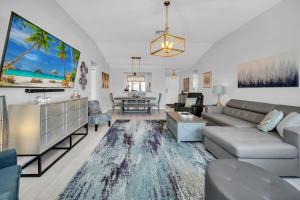 a living room with a couch and a table at Waterfront 3Bed in The Villages in The Villages