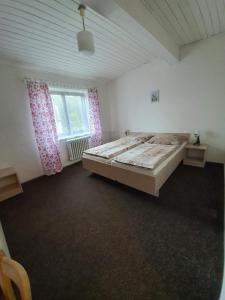 Postel nebo postele na pokoji v ubytování Penzion Hilšer
