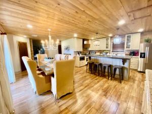 a kitchen and dining room with a table and chairs at The Manor House in Kingston