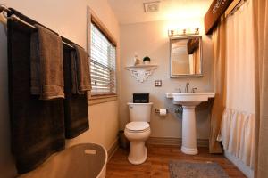 a bathroom with a toilet and a sink at The Manor House in Kingston
