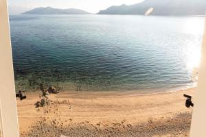 a view of a beach and the water at Apartments in Baska - Insel Krk 41026 in Baška