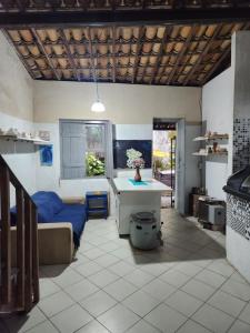a living room with a couch and a table at Katai in Salvador +15 photos