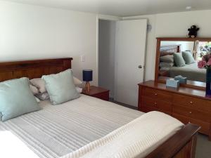 Ένα ή περισσότερα κρεβάτια σε δωμάτιο στο Modern and spacious 1-Bedroom Holiday Home