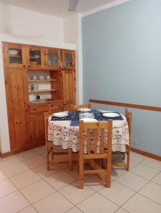 a dining room with a table and two chairs at Holiday Maio in Calheta Do Maio