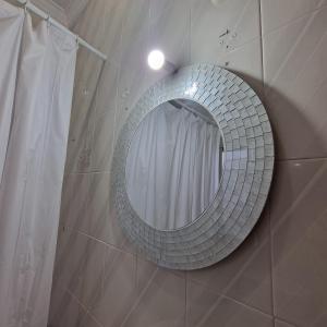 a mirror on the wall of a bathroom at 'La Casa de la Motera' by Turismodecalidad in Algodonales +29 photos