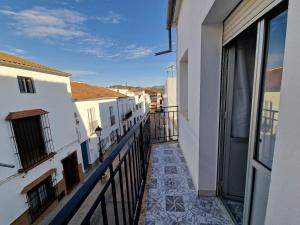 a balcony of a building with a view of a street at 'La Casa de la Motera' by Turismodecalidad in Algodonales