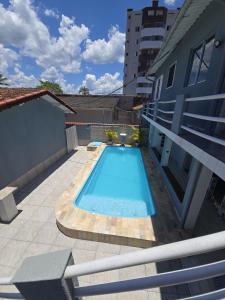 Imagine din galeria proprietății Edícula completa com piscina în Mongaguá
