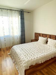 En eller flere senge i et værelse på Premier Flat with Parking