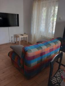 TV/trung tâm giải trí tại Doli Apartment