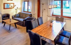 a living room with a table and a couch at Ferienhaus 1 In Kirchheim in Kirchheim