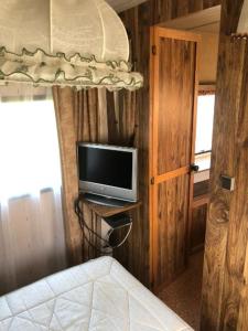 TV a/nebo společenská místnost v ubytování Hacienda Caravan