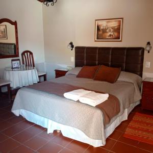 Ένα ή περισσότερα κρεβάτια σε δωμάτιο στο El Portal de La Quebrada