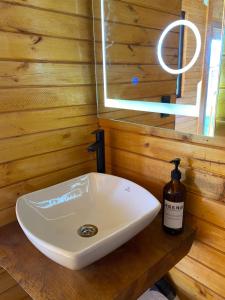 a bathroom with a sink in a wooden wall at Skema Collections Quito in Quito +27 photos
