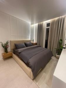 a bedroom with a large bed in a room at Endis House in Shëngjin