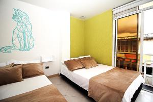 Voodi või voodid majutusasutuse DAM Hotel Pereira toas