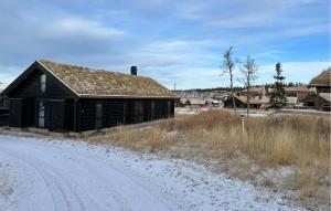an old building on the side of a dirt road at Amazing Home In Øyer With Wifi in Øyer +4 photos