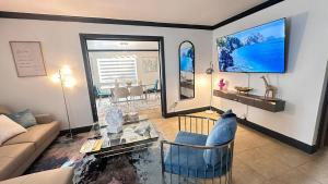 a living room with a couch and a glass table at Luxury Home by Miami Int Airport in Miami