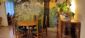 a dining room with a table and chairs at Apartament Multik in Tarnów