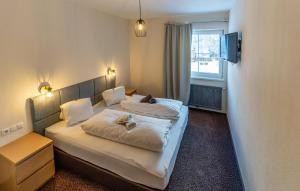 Postel nebo postele na pokoji v ubytování Attraktive Ferienwohnung Wagr,