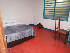 Postel nebo postele na pokoji v ubytování Hotel Deltoro