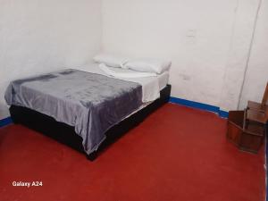 Postel nebo postele na pokoji v ubytování Hotel Deltoro