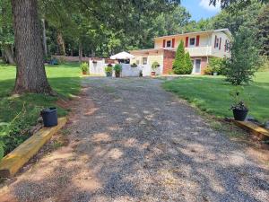 an empty driveway in front of a house at Quiet Retreat for Business or Family Trip in Charlotte