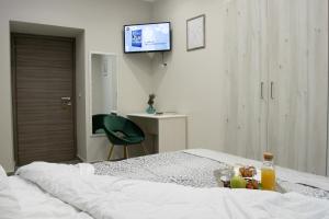 Postel nebo postele na pokoji v ubytování Le Mirage boutique II