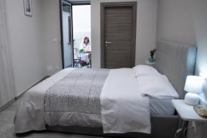 Postel nebo postele na pokoji v ubytování Le Mirage boutique II